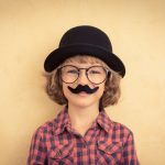 Funny kid with fake mustache