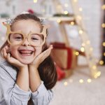 Portrait of adorable girl with funny glasses